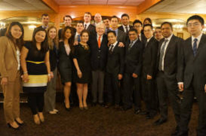 Dr. Athannasakos' Value Investing class poses with Mr. Buffett