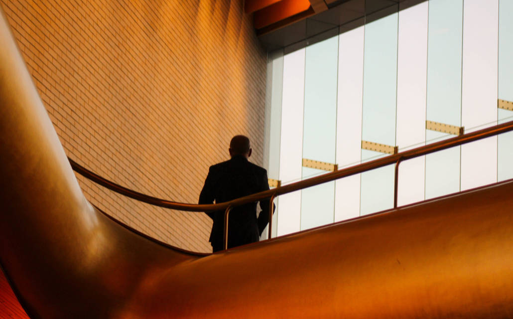 Silhouette Of A Person Behind 2Nd Floor Railing