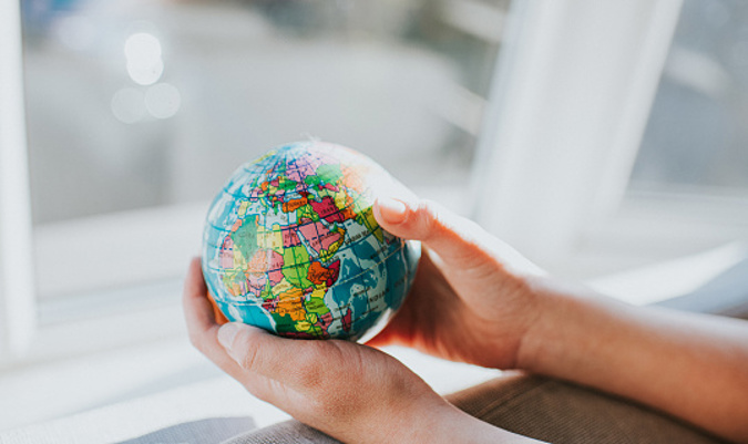 Global Ivey Day Holding A Globe