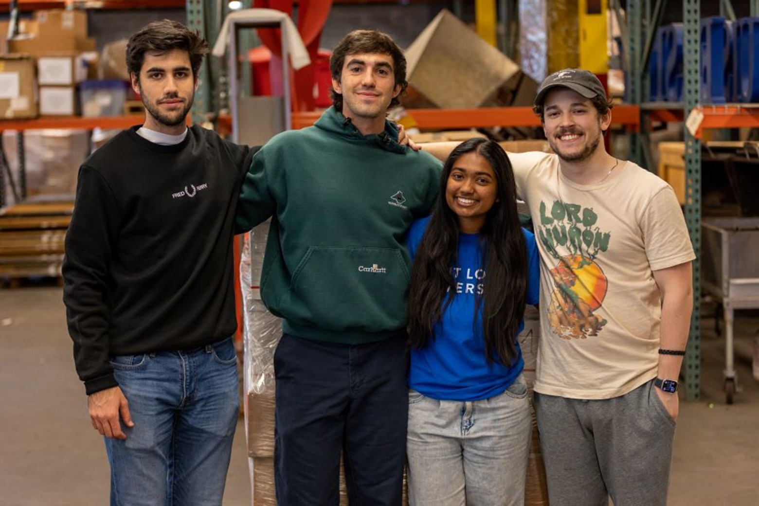 The team at Saint Louis University smiling after seeing the books off.