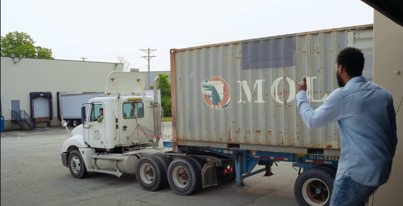 Thumbs up. The moving truck is taking the 500 boxes of textbooks to the port.